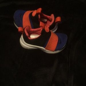 Blue and orange Nike prestos